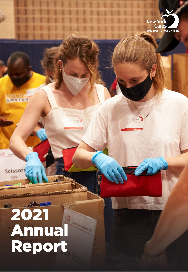 Two women in white shirts, surgical masks and blue gloves sorting items