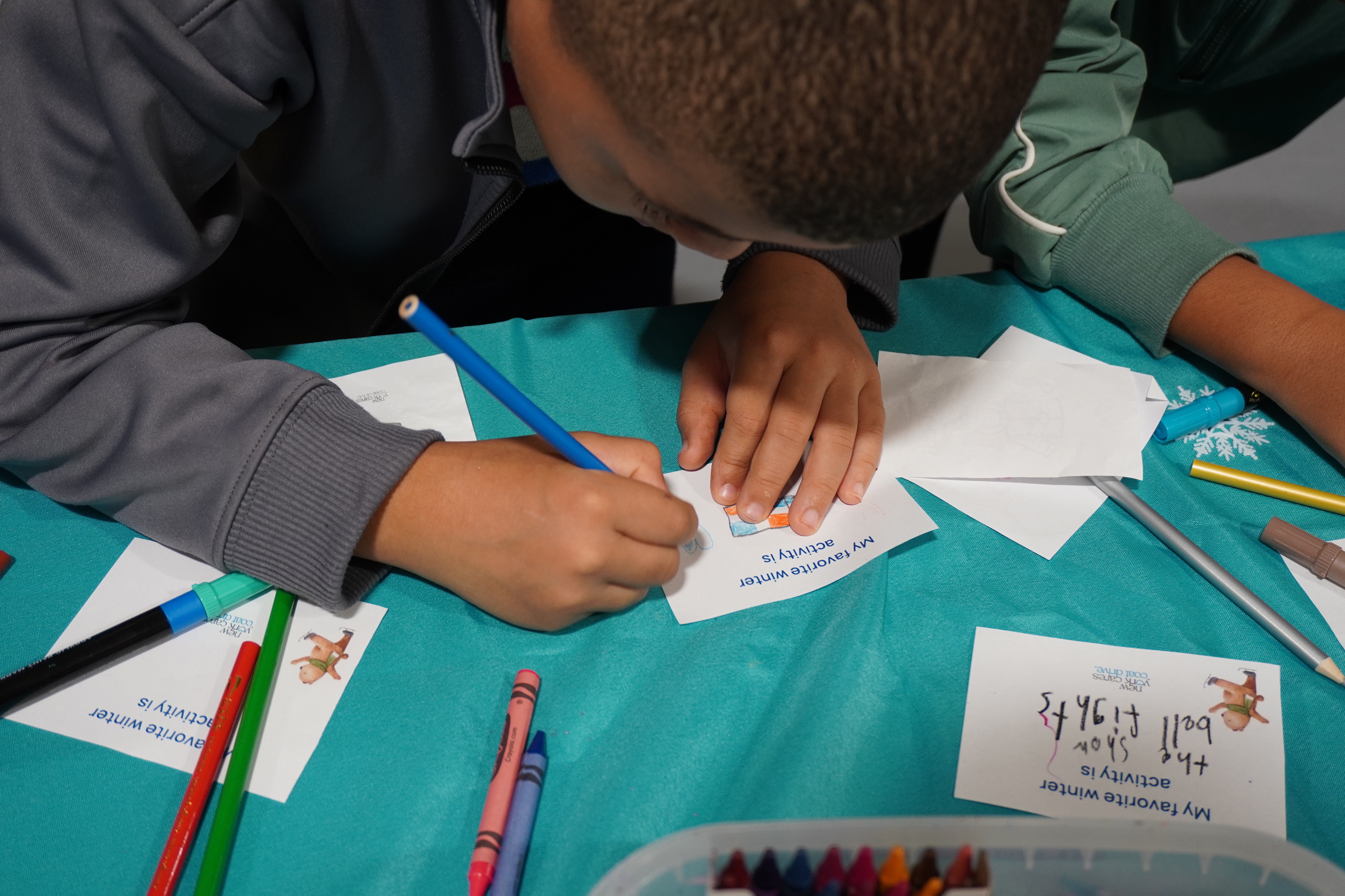 Student coloring at CD Kickoff